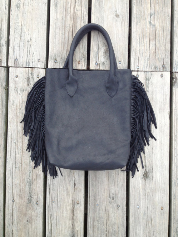 A subtle reminder of the '70s, this is her soft black leather tote bag with fringe. Courtesy Erin Little