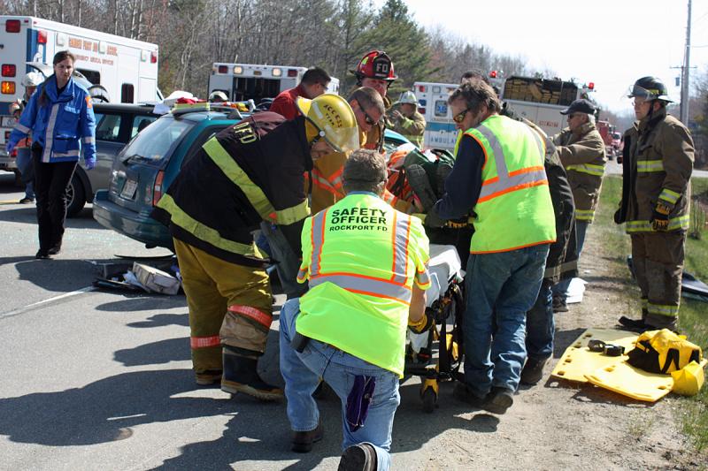Melissa Parker is removed from the station wagon and placed on a stretcher. (Photo by Holly S. Edwards)