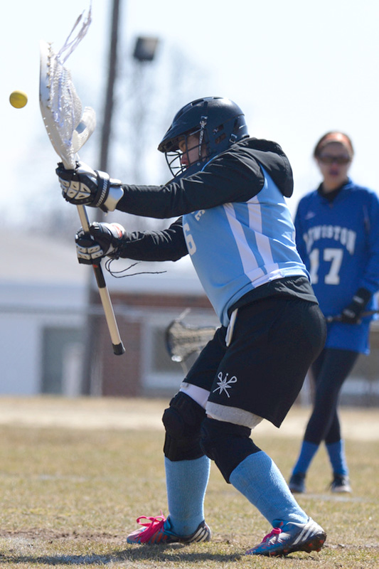 Oceanside's Jalynn Hurd gets her stick up to make one of many saves on the day. (Photo by Ron Hawkes)