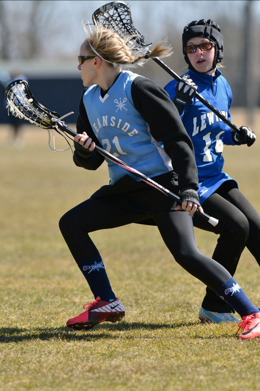 Oceanside's Cheyenne Montgomery spins around ger defender to advance up the field. (Photo by Ron Hawkes)