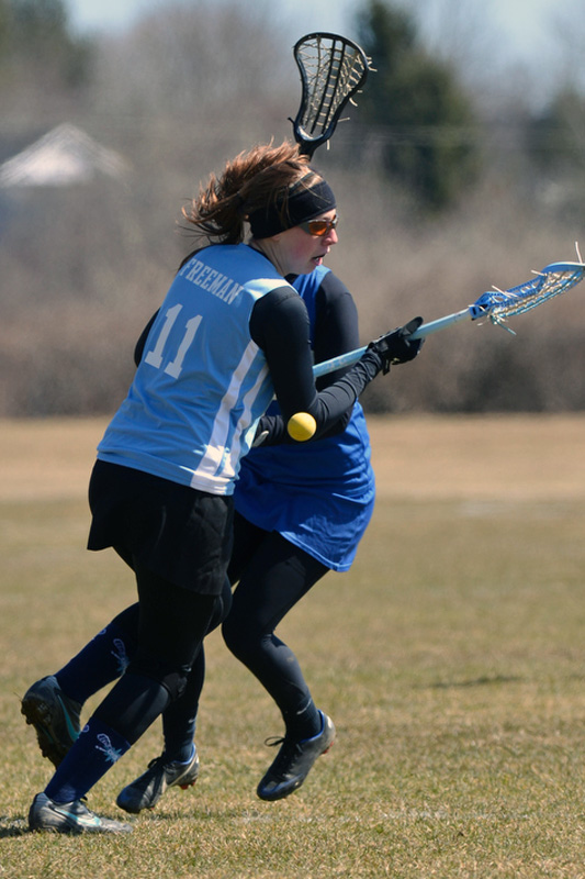 Oceanside's Rebecca Freeman trys to pick up a loose ball. (Photo by Ron Hawkes)