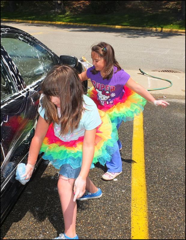 Teamwork works when washing cars.
