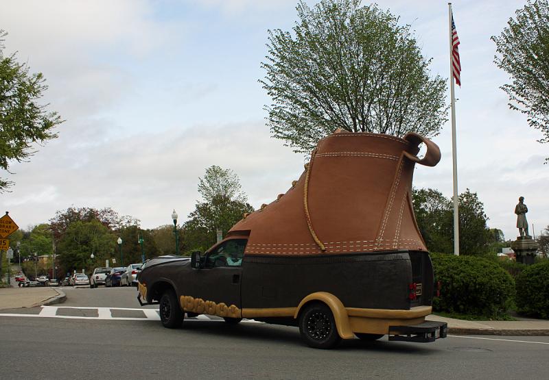 The LL Bean Bootmobile turns onto Atlantic Avenue for a quick stop alongside the Camden Amphitheater and Harbor Park Monday afternoon. (Photo by Holly S. Edwards)