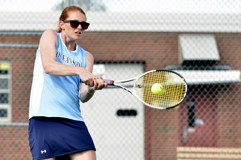 Oceanside's Phoebe Ferriaolo returns a hard serve. (Photo By Ron Hawkes)