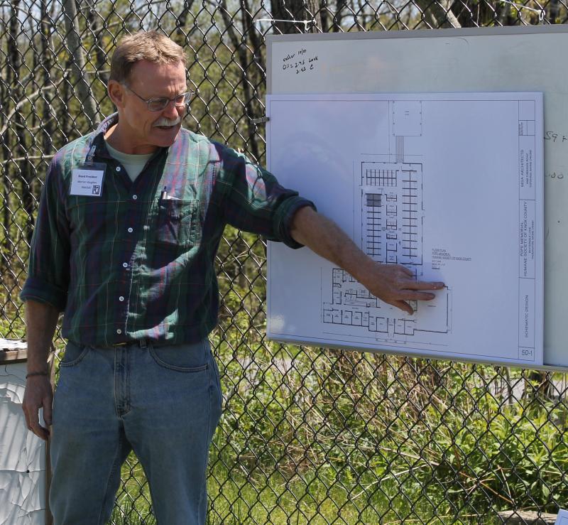 Outgoing President Warner Vaughan of the Pope Memorial Humane Society of Knox County presents the floor plan of the proposed new shelter.