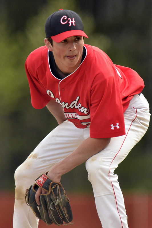 Camden Hills starting pitcher Sam Berry gets the sign before delivering th epitch. (Photo by Ron Hawkes)