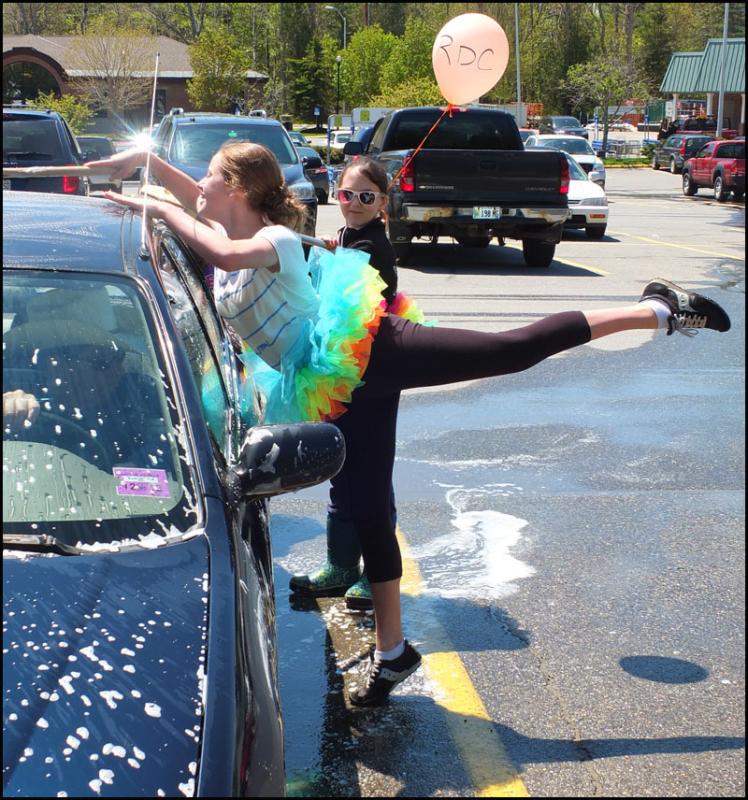 Proper form is important when you dance and wash a car at the same time.
