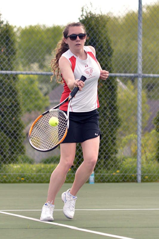 Camden Hills' Camilla Walker returns this serve for a point. (Photo by Ron Hawkes)
