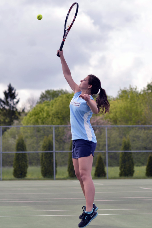 Oceanside's Hannah Lacasse gets her racquet up high to return this violley. (Photo by Ron Hawkes)