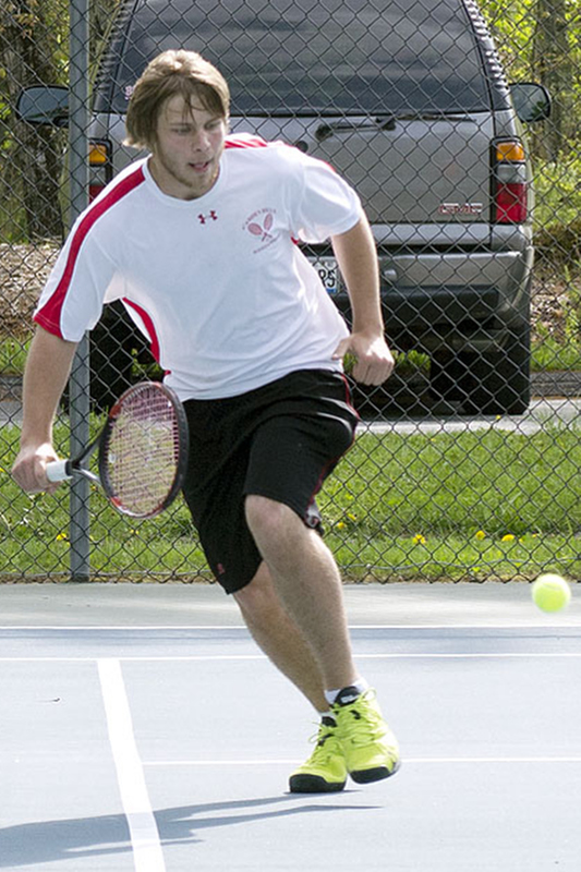 Camden Hills Marc Belley retunrs a volley. (Photo Courtesy of Dwight Pitcairn)