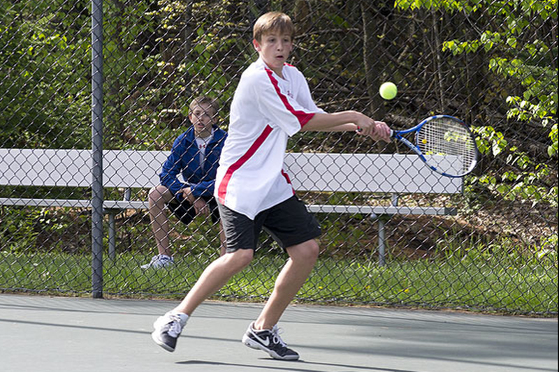 Camden Hills Luke Burstein backhands the ball in the No. 3 singles match. (Photo Courtesy of Dwight Pitcairn)