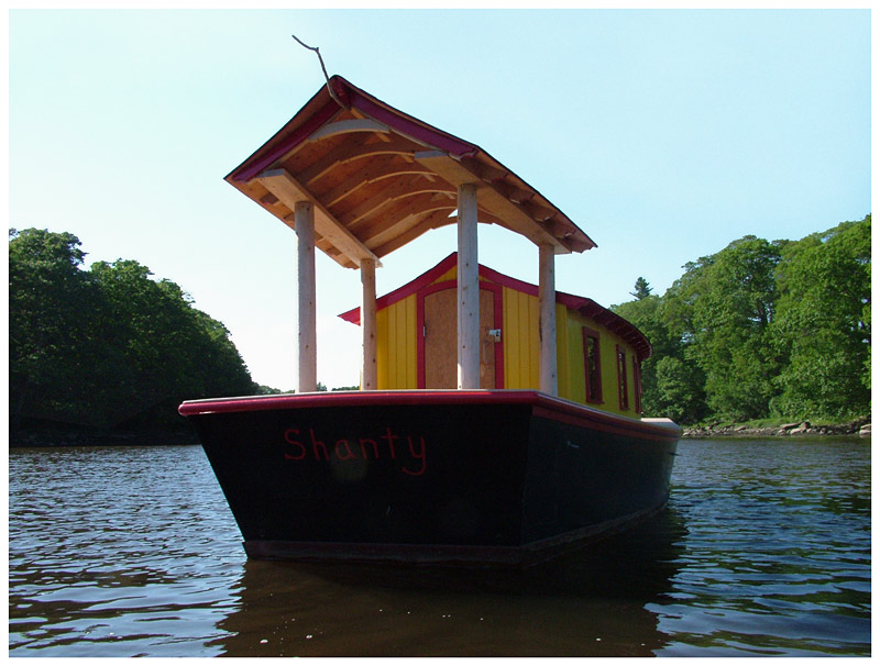 A canopy on over the open afterdeck of "Shanty" includes a stick from which Haslett hopes a kingfisher might want to perch for a better view to the water. (Photo by Ethan Andrews)