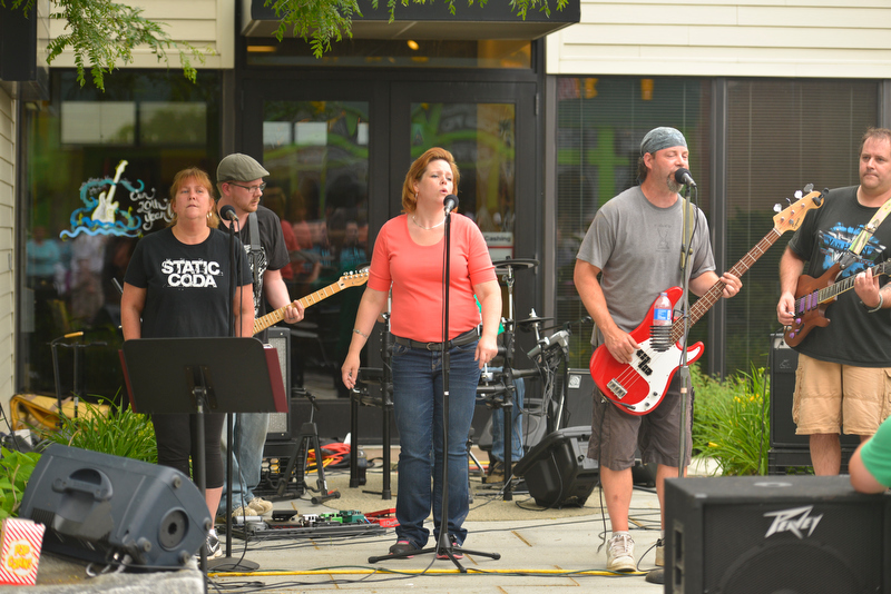 Local rock band Static Coda played outside the Key Bank. (Photo by Ron Hawkes)