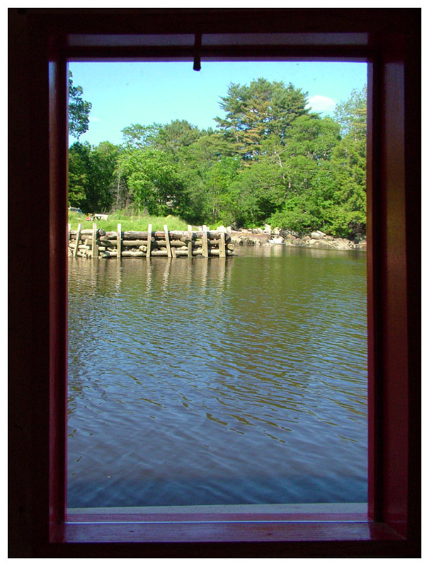 A view out one of Shanty's rectangular windows, toward Board Landing, a former mill dock on the Passagassawakeag River in Belfast. (Photo by Ethan Andrews)