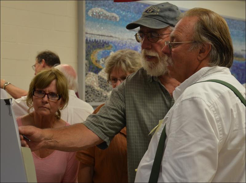 Camden citizens and business owners gather at the Camden-Rockport Middle School June 24 with consultants to critique draft plans for a redesigned public landing and walkway along the Megunticook River. (Photo by Lynda Clancy)