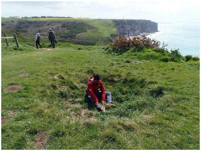 I paused to examine a bomb crater. (Photo by Ari Snider)