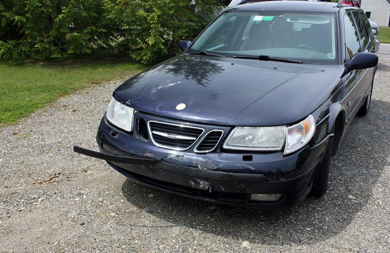 Camden resident Jeffrey Zurkow's Saab stationwagon sustained minimal damage from the impact of the oncoming motorcycle Monday. (Photo by Holly S. Edwards)