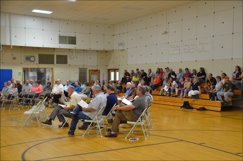 The gymnasium at Hope Elementary School is partially filled at the 2013 annual Town Meeting. (Photo by Lynda Clancy)