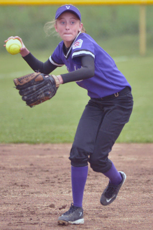 Islander Paige Dennison makes the throw to first base for the out. (Photo by Ron Hawkes)