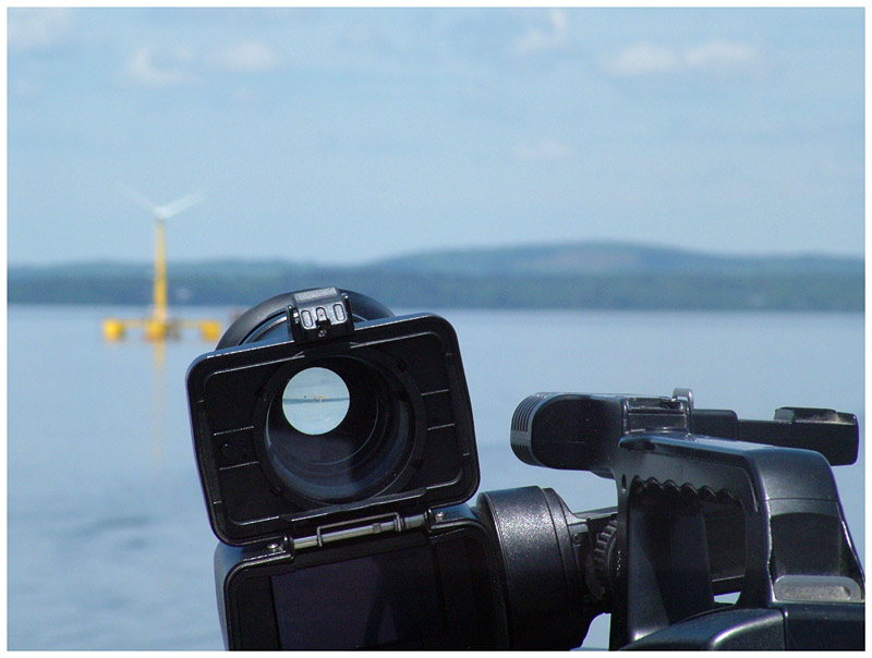 A television camera lens trained on the offshore wind turbine VolturnUS 1:8. (Photo by Ethan Andrews)