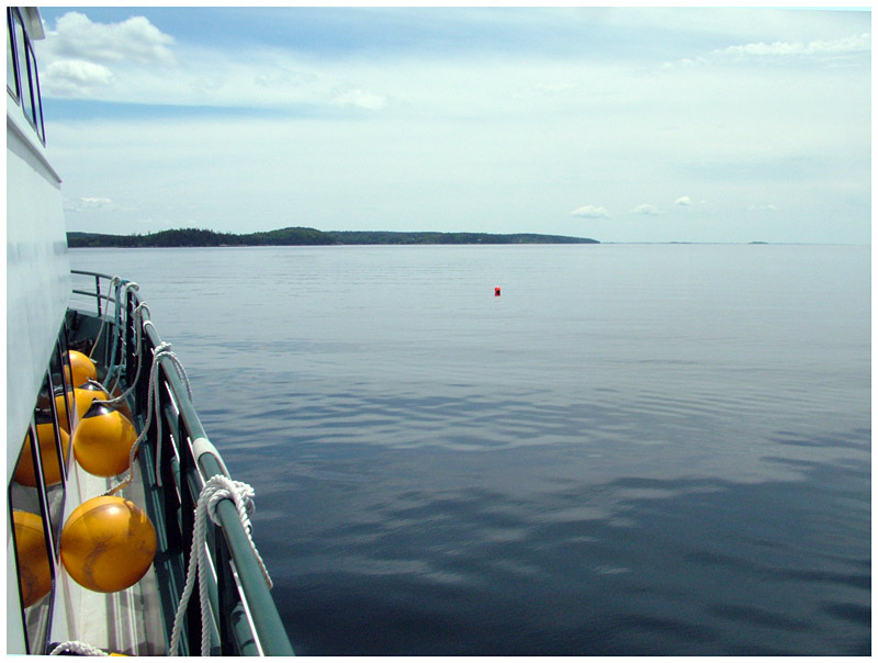 Wind was in short supply Thursday, as evidenced by the glassy waters surrounding Maine Maritime Academy's "Ned" just outside Castine Harbor (Photo by Ethan Andrews)