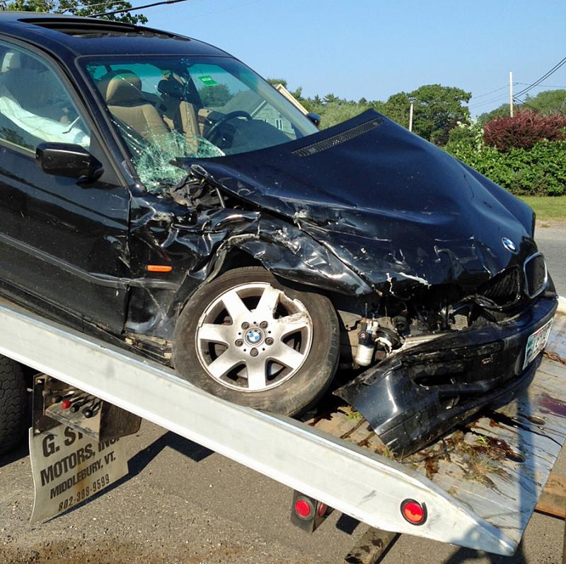This 2000 BMW sedan, being driven by Amy Hirakis, was totalled in a crash in Rockport late Wednesday afternoon. (Courtesy Rockport Fire Dept.)