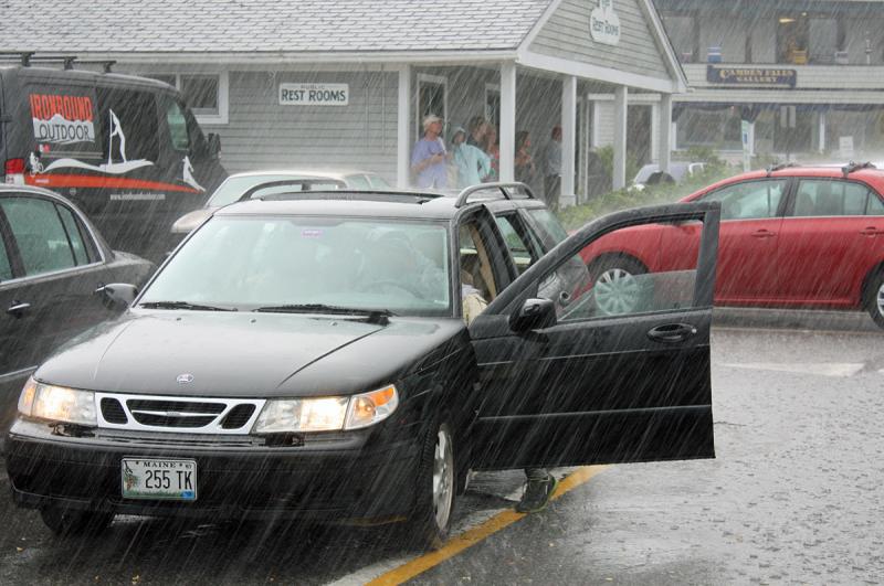 Camden Harbormaster Steve Pixley realized too late his car's sunroof and front windows were all. (Photo by Holly S. Edwards)