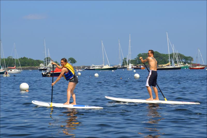 Ashleigh and Eric Verite take advantage of a hot July 4 in Camden to paddle. (Photo by Lynda Clancy)