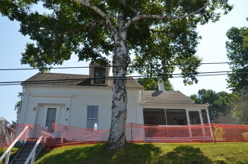 An old home, built sometime in the early 19th-Century, was torn down July 17 in Rockport Village to make way for open space. (Photo by Lynda Clancy)