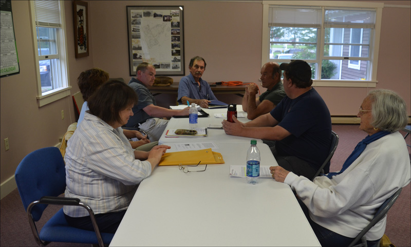 The Owls Head Volunteer Fire Company Board of Directors, from left around the table: Selectman Nancy Colson, Selectman Linda Post, Selectman Dick Carver, Fire Department volunteer Andy York, Company President Tim Sternberg and Company Treasurer May Grant. (Photo by Lynda Clancy)