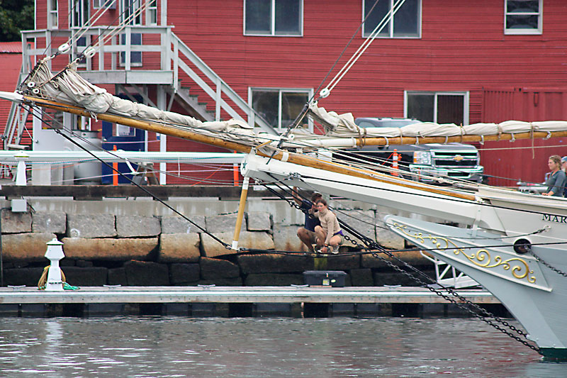 Crew prepare to catch lines as their schooner enters Camden Harbor. (Photo by Holly S. Edwards)