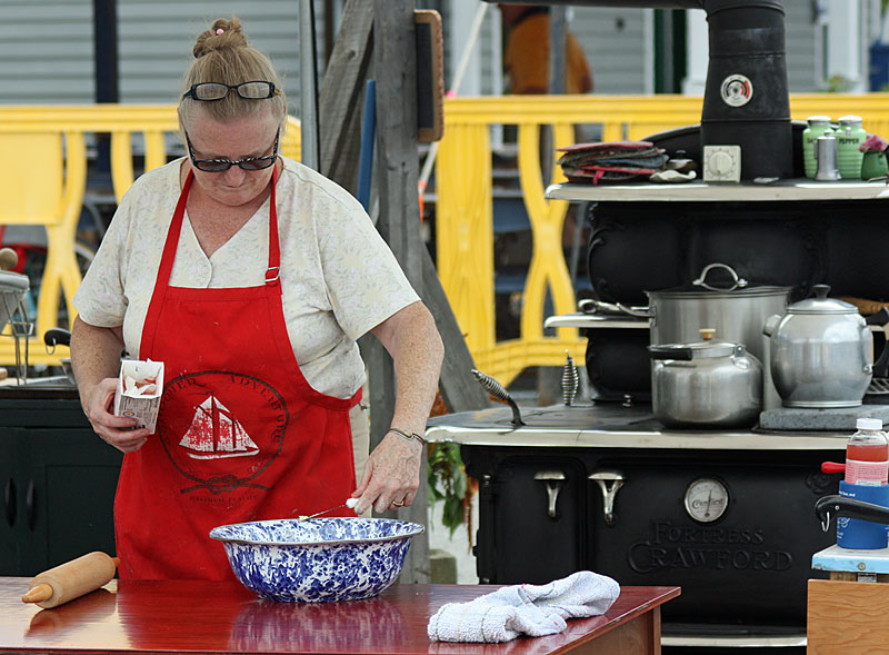 Bridget Qualey will again demonstrate the art and science behind cooking on a wood stove – with tips on how to do it at sea. (Photo by Holly S. Edwards)