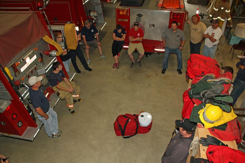 The night's training in begins with role assignments, a rescue walk-through and an overview of equipment they'll be using. (Photo by Holly S. Edwards)