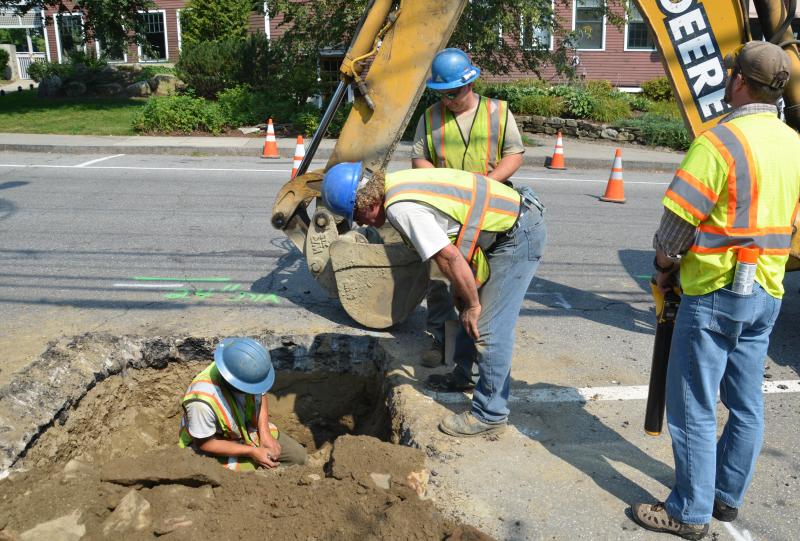 Eric Kenefick,Shaun McNulty, Lee Philbrook, all Maine Water employees, along with Matt Jandreau, of On Target, a contractor for Dig Safe. (Photo by Lynda Clancy)