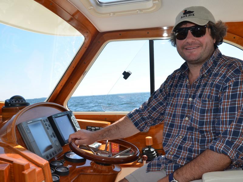 Jared Cummings, owner of the Osprey, a charter boat based in Camden, captains one of the chase boats. (Photo by Lynda Clancy)