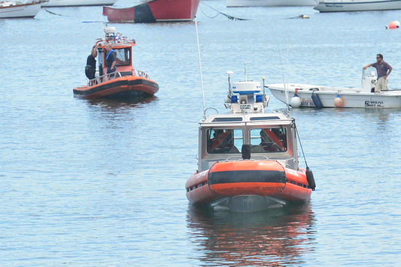 U.S. Coast Guard, Rockland Police Department and Rockland Harbor boats search the city's inner harbor for a missing diver Sunday afternoon. (Photo by Ron Hawkes)