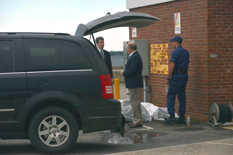 The funeral home waits at the Coast Guard station at the end of Tillson Avenue in Rockland to transport the deceased diver, not pictured, to the State Medical Examiner's Office. (Photo by Ron Hawkes)