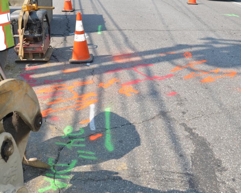Ever wonder whose colors belongs to whom? Orange is communication, alarm, or signal lines; red is electric power lines (Central Maine Power); green is sewer and drain lines