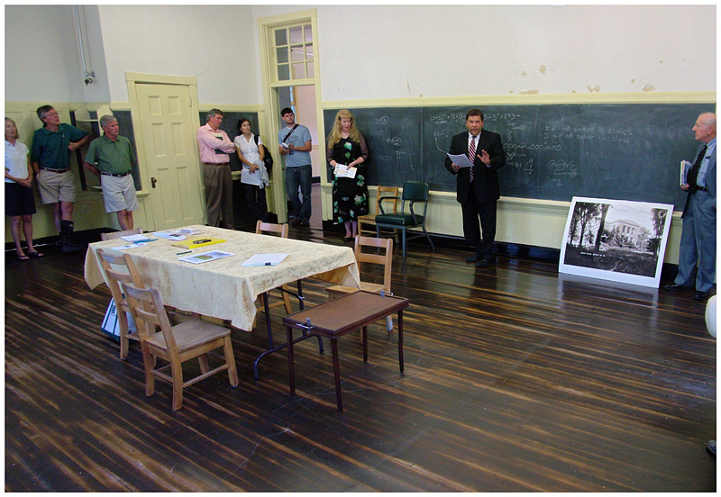 “I normally feel compelled to say, ‘Good morning ladies and gentlemen,’ but I have an urge to say, ‘Good morning class,’” said auctioneer Stefan Keenan at Wednesday’s sale of the former Peirce Elementary School. (Photo by Ethan Andrews)
