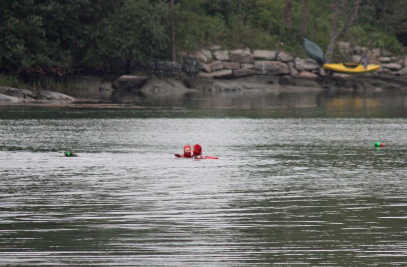 Thomaston firefighter Colby Miles reaches 'victim' Chief Bryan Calderwood during water rescue training July 29. (Photo by Holly S. Edwards)