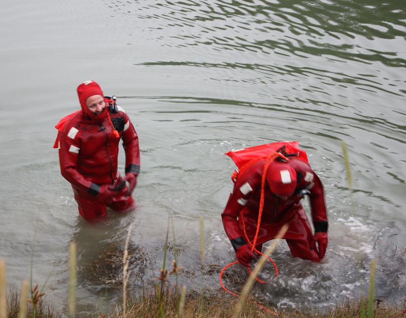 Making their way to shore from the middle of the Weskeag River are Bryan Calderwood and Colby Miles. (Photo by Holly S. Edwards)
