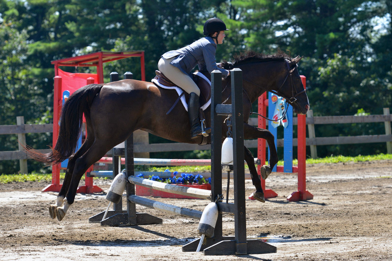 Katherine Orne riding in a competition at the Stonewall Stables in Nobleboro Saturday. (Photo by Ron Hawkes)