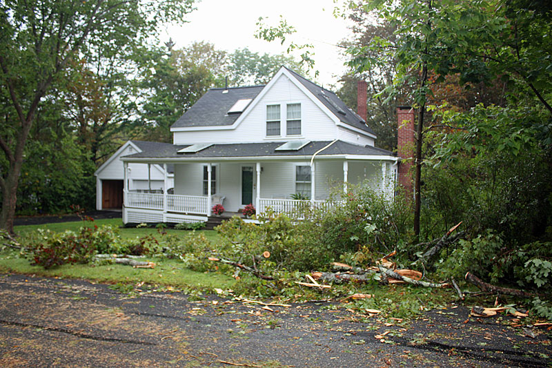 Electric service connects to many homes in the heavily damaged towns are ripped from buildings still Thursday morning. (Photo by Holly S. Edwards)