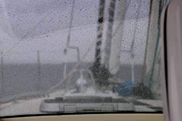 Looking out through the rain, at Kiwi Spirit's deck and the sea ahead, I imagine the days of solitude ahead for Stanley Paris. (Photo by Shlomit Auciello)