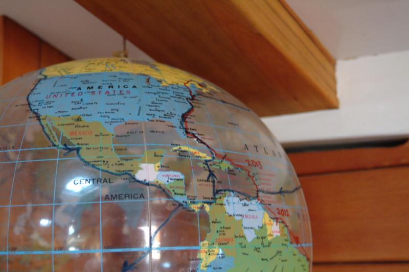 Jim and Karin Lott keep track of their voyages on a plastic globe that hangs in the saloon of their 50-foot ketch, Victoria. (Photo: Shlomit Auciello)