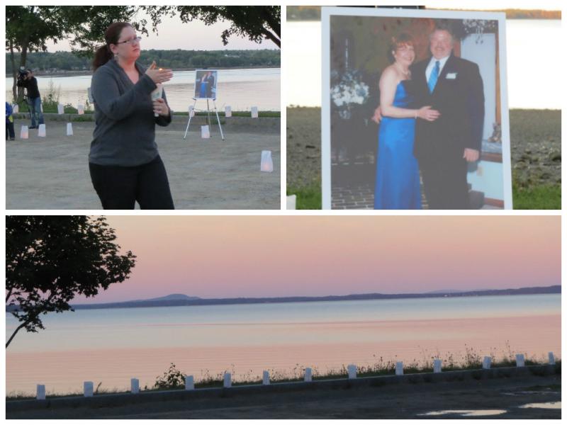 A picture of Lynn Arsenault and her husband on their wedding day sits in front of the bay during a Sept. 6 candle light vigil in her honor. (Photo by Erica Thoms)