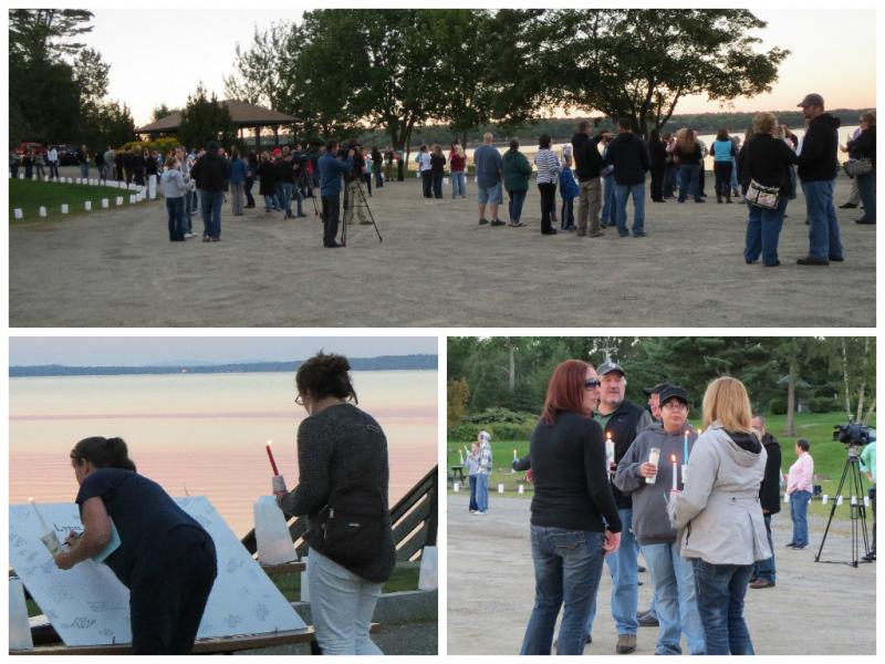 People gather during the Sept. 6 candle light vigil for Lynn Arsenault, held in Belfast City Park. (Photos by Erica Thoms)