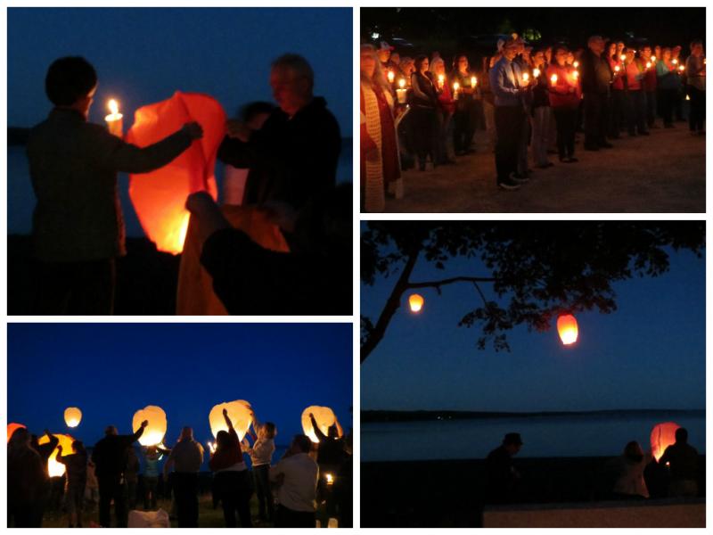 Paper lanterns are lit and released over the water near the conclusion of a candle light vigil for Lynn Arsenault in Belfast Sept. 6. (Photo by Erica Thoms)