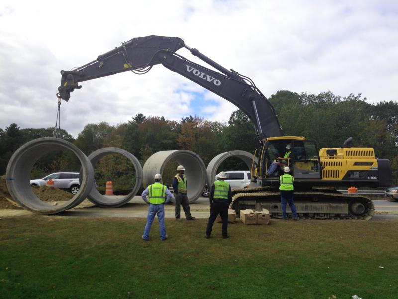 Concrete pieces manufactured in St. John, New Brunswick, are being pieced together to make a new culvert under Route 90 at Tolman Pond. (Photo by Lynda Clancy)