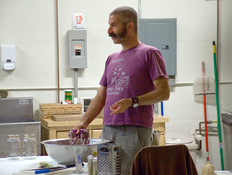 Fermentation expert Sandor Katz prepares a batch of sauerkraut during a talk the age old food preservation method at Waterfall Arts, Sept. 19. (Photo by Ethan Andrews)